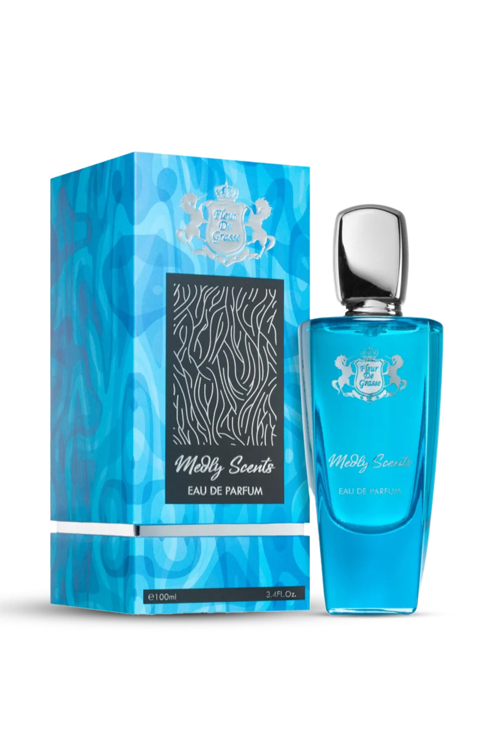 A bottle of FLEUR DE GRASSE MEDLEY SCENTS EAU DE PARFUM 100 ML fragrance with its packaging box. The bottle is transparent with a blue liquid inside and the packaging has a blue and black design.