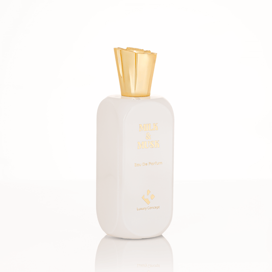 Minimalist Milk & Musk fragrance bottle with creamy white finish and refined label, suggesting honeyed balsamic heart and aromatic musk base.
