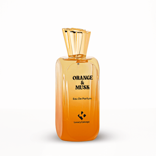 Orange & Musk unisex fragrance bottle with refined silhouette and light amber liquid, suggesting crisp citrus and warm musk sophistication.