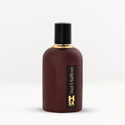 Oud & Saffron bottle with refined masculine profile and deep hues, suggesting oud, rose, amber, and leather notes for a commanding luxury scent.