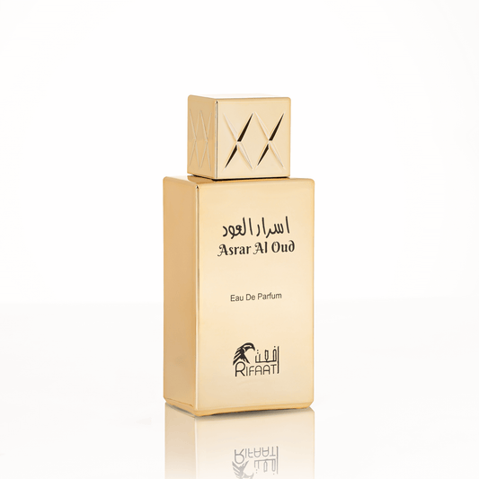 Gold-toned heavy glass perfume bottle with a textured cap and elegant calligraphy label, capturing UAE luxury and rich oud character.