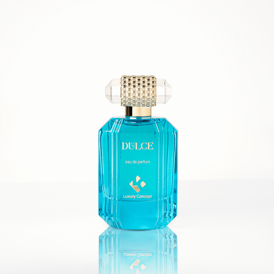 Deep blue glass perfume bottle with a gleaming gold cap and refined silhouette, evoking modern Arabian elegance in the UAE.