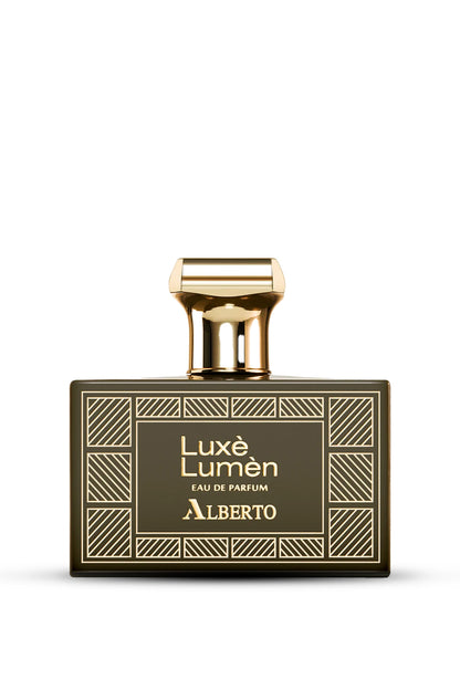 A bottle of Alberto Luxes Lumen Eau de Parfum with a gold-colored cap and a label featuring geometric patterns.