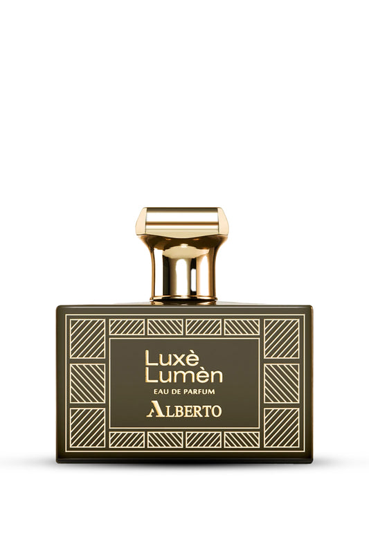 A bottle of Alberto Luxes Lumen Eau de Parfum with a gold-colored cap and a label featuring geometric patterns.