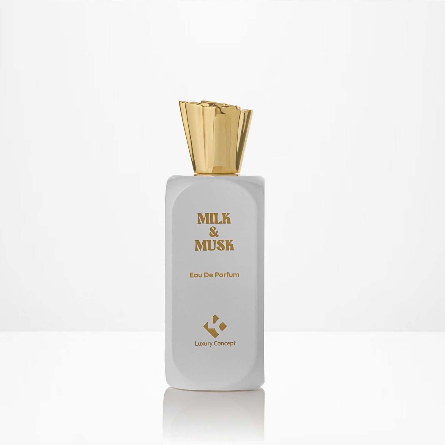 Perfume bottle labeled 'Milk & Musk' with a gold cap on a white background