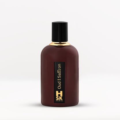 Dark purple Oud & Saffron extrait de parfum bottle with bold black cap and gold lettering, reflecting rich oud and warm saffron spice character.