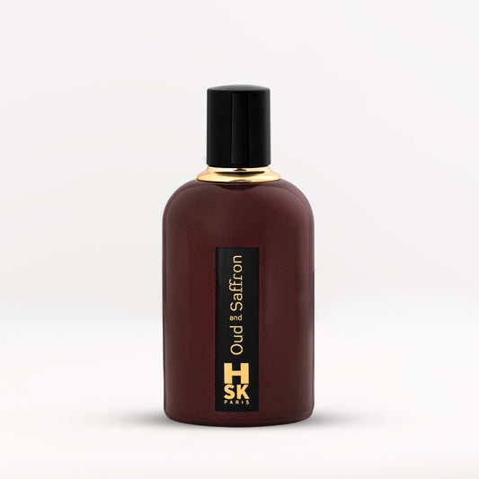 Dark purple Oud & Saffron extrait de parfum bottle with bold black cap and gold lettering, reflecting rich oud and warm saffron spice character.