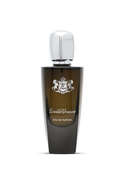 A dark glass bottle of SCENTED DREAMS EAU DE PARFUM with a silver cap and white label featuring elegant typography.